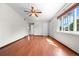 Inviting living room featuring hardwood floors and large windows at 707 Uvalda St, Aurora, CO 80011