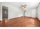 Open-concept living room featuring hardwood floors and a ceiling fan at 707 Uvalda St, Aurora, CO 80011