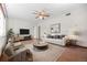 Bright living room featuring a ceiling fan, a comfortable sofa, and modern furniture at 707 Uvalda St, Aurora, CO 80011