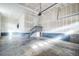 Spacious two car garage with stairs leading to an interior door at 14221 Ivanhoe St, Thornton, CO 80602