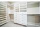 Organized walk-in closet with built-in shelving, drawers, and ample storage space at 14221 Ivanhoe St, Thornton, CO 80602