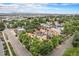 Aerial view of neighborhood with tree lined streets and views of the mountains at 7 Elati St, Denver, CO 80223
