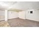 Basement with carpeted floors, white walls, and a small window allowing natural light at 7 Elati St, Denver, CO 80223
