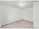 Empty bedroom showcasing tile flooring and white walls, awaiting your personal touch at 7 Elati St, Denver, CO 80223