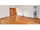 Bedroom featuring beautiful hardwood floors, large closet and ensuite bathroom at 7 Elati St, Denver, CO 80223