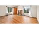 Bright bedroom with hardwood floors, fireplace, and large windows with backyard views at 7 Elati St, Denver, CO 80223