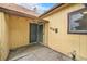 Exterior shot of the house entrance with address number 519 and a metal screen door at 7 Elati St, Denver, CO 80223