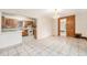 View of the living space, adjoining the kitchen with tile floors at 7 Elati St, Denver, CO 80223
