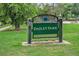 Dailey Park sign on a green lawn at 7 Elati St, Denver, CO 80223