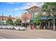 Vibrant street view with various businesses, parking, and a blue sky enhancing the urban landscape at 7 Elati St, Denver, CO 80223