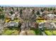 An aerial view showcases the property's location in a neighborhood surrounded by mature trees at 2975 S Jackson St, Denver, CO 80210