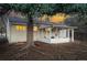 Backyard with sunroom provides a serene outdoor living area at 2975 S Jackson St, Denver, CO 80210