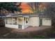 Backyard with sunroom, patio, and lush lawn provides outdoor enjoyment at 2975 S Jackson St, Denver, CO 80210