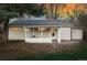 Backyard with patio and sunroom offers a private outdoor living space at 2975 S Jackson St, Denver, CO 80210