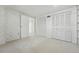 Bedroom with white walls and closets offers a clean and functional space at 2975 S Jackson St, Denver, CO 80210