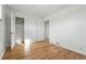 Bright bedroom with wood floors, closet, and neutral paint provides a cozy retreat at 2975 S Jackson St, Denver, CO 80210
