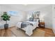 Cozy bedroom with hardwood floors, a comfortable bed, and ample natural light at 2975 S Jackson St, Denver, CO 80210