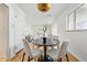 Dining area featuring a modern light fixture, black table and seating for four people at 2975 S Jackson St, Denver, CO 80210