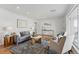Cozy living room with hardwood floors, comfortable seating, stylish decor and lots of natural light at 2975 S Jackson St, Denver, CO 80210