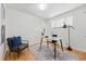 Bright office space with wood floors and a stylish desk and chair setup at 2975 S Jackson St, Denver, CO 80210