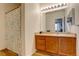 Bathroom with wood cabinets, spacious countertops and shower curtain at 5723 N Gibralter Way # 205, Aurora, CO 80019