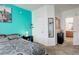 Bedroom with turquoise wall, closet, and vanity with modern bathroom access at 5723 N Gibralter Way # 205, Aurora, CO 80019