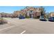 Apartment complex with brick facade, balconies, and ample parking at 5723 N Gibralter Way # 205, Aurora, CO 80019