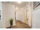 Hallway with carpet floors and doors leading to the bathroom and other rooms at 5723 N Gibralter Way # 205, Aurora, CO 80019