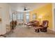 Welcoming living room with a fireplace, large windows, and stylish furniture at 5723 N Gibralter Way # 205, Aurora, CO 80019