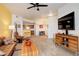 Open-concept layout featuring a breakfast bar connecting the living room to the kitchen at 5723 N Gibralter Way # 205, Aurora, CO 80019