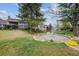 Picturesque backyard featuring a water fountain and expansive green lawn at 6917 E Girard Ave, Denver, CO 80224