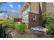 Beautiful backyard with landscaped rocks, bushes and patio set with a backdrop of brick exterior at 6917 E Girard Ave, Denver, CO 80224