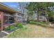 Beautiful backyard featuring a patio area, manicured garden, and large grassy lawn at 6917 E Girard Ave, Denver, CO 80224