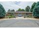 The community clubhouse has mature trees and landscaping around the building at 6917 E Girard Ave, Denver, CO 80224