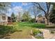 Lush green common area featuring well-manicured lawns and mature trees at 6917 E Girard Ave, Denver, CO 80224