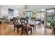 Charming dining area showcases hardwood floors, stylish seating, and seamless transition to outdoor patio at 6917 E Girard Ave, Denver, CO 80224