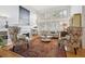 Spacious living room with hardwood floors, fireplace, large windows, and comfortable seating at 6917 E Girard Ave, Denver, CO 80224