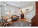 Cozy living room with comfortable seating, natural light, and stylish decor and a beautiful rug at 6917 E Girard Ave, Denver, CO 80224