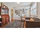 Comfortable living room with warm wood floors, stylish decor, and natural light from shuttered windows at 6917 E Girard Ave, Denver, CO 80224