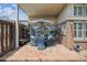 Inviting covered patio with ample seating, plants, and brick accents perfect for outdoor relaxation at 6917 E Girard Ave, Denver, CO 80224