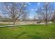 Community playground surrounded by lush green lawns and mature trees at 6917 E Girard Ave, Denver, CO 80224