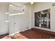 Laundry area with tile flooring, white cabinets and sliding door to backyard at 7165 S Vine W Cir, Centennial, CO 80122