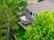 Expansive backyard featuring a spacious wooden deck perfect for outdoor living and entertainment amidst lush greenery at 9552 E Caley Cir, Englewood, CO 80111