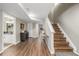 Finished basement hallway features hardwood floors and leads to a cozy seating area at 9552 E Caley Cir, Englewood, CO 80111