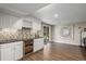 Basement bar features stylish cabinetry, wine storage, and a wet bar at 9552 E Caley Cir, Englewood, CO 80111