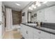 Bathroom features updated vanity, tub, tile, and fixtures at 9552 E Caley Cir, Englewood, CO 80111