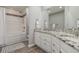Modern bathroom featuring a granite countertop, a soaking tub, and wood-look tile at 9552 E Caley Cir, Englewood, CO 80111