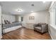 Spacious bedroom with hardwood floors, comfortable furniture, and plenty of natural light at 9552 E Caley Cir, Englewood, CO 80111