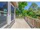 Spacious wooden deck perfect for outdoor entertaining with scenic backyard views at 9552 E Caley Cir, Englewood, CO 80111