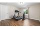 Bright exercise room featuring a treadmill, bench, and natural light at 9552 E Caley Cir, Englewood, CO 80111